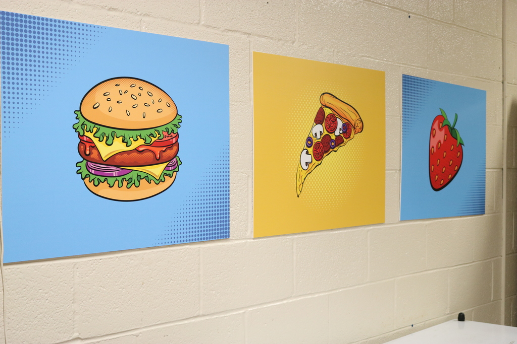 new cafeteria signs for Lawson Elementary. These show a cheeseburger, pizza, and strawberry