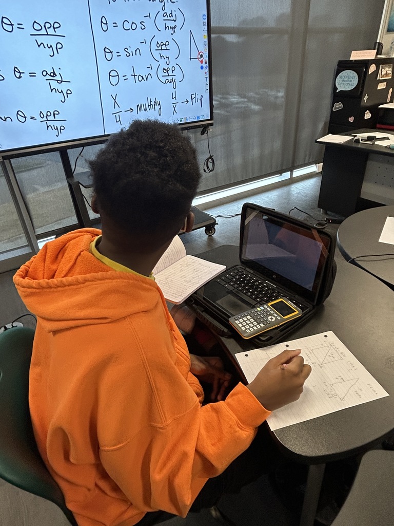 Student taking notes in math class