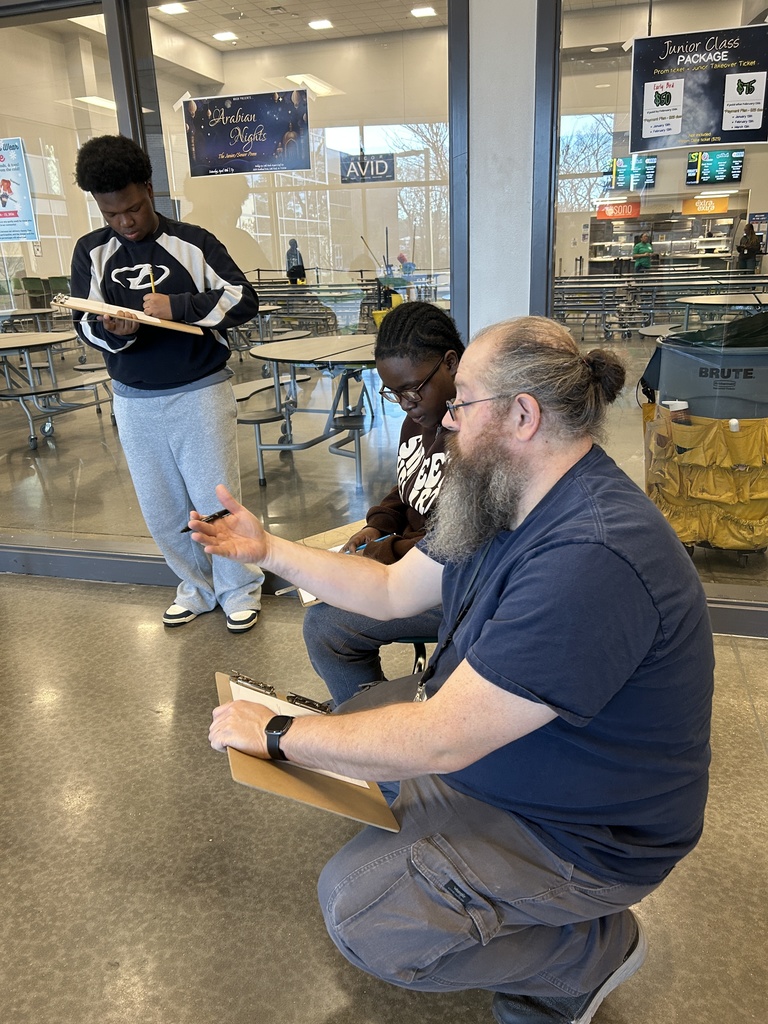 art teacher discussing techniques with a student