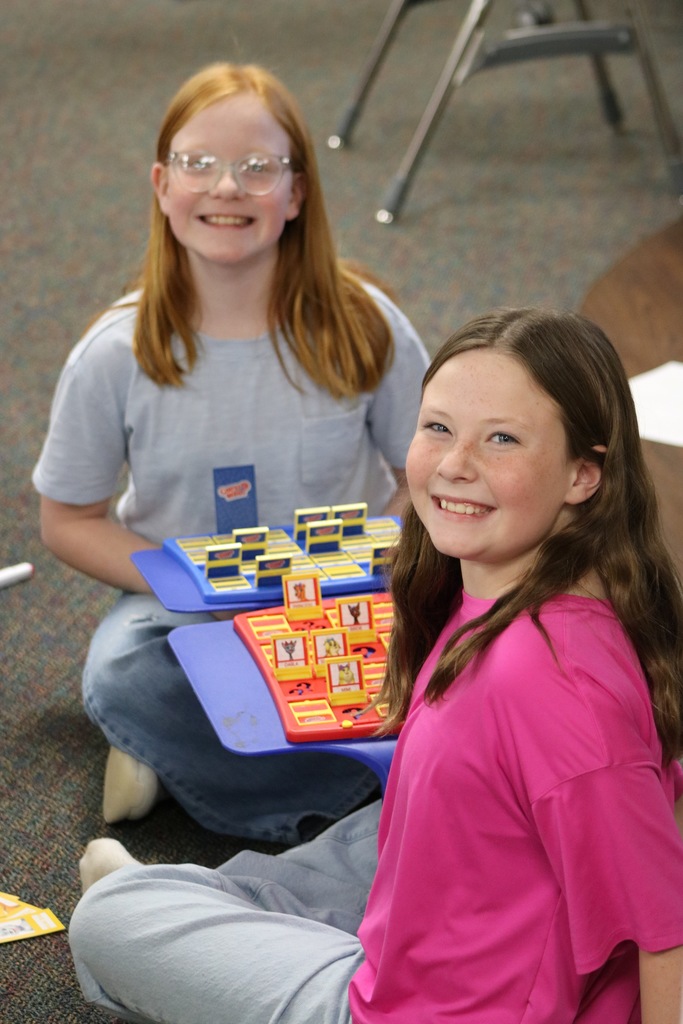 Kids smiling playing Guess Who