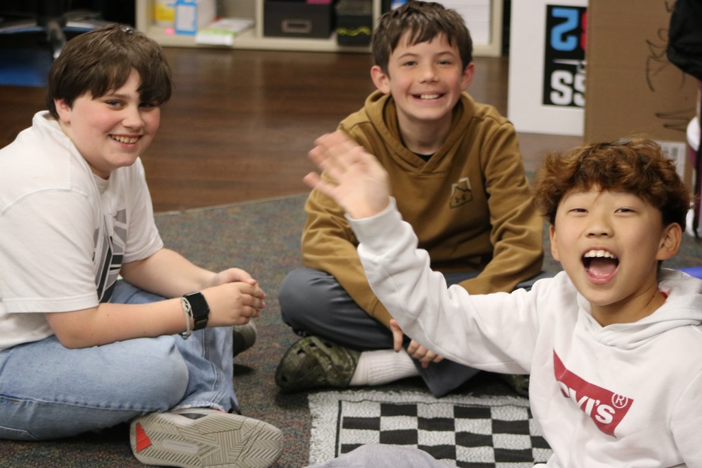 kids smiling playing checkers