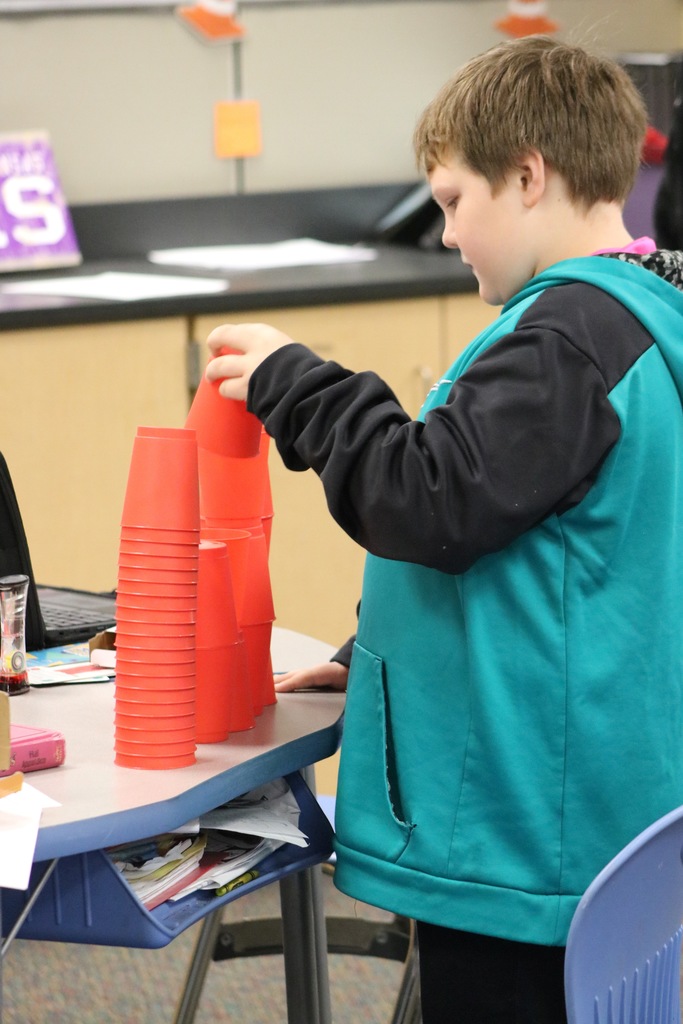 Kid stacking cups