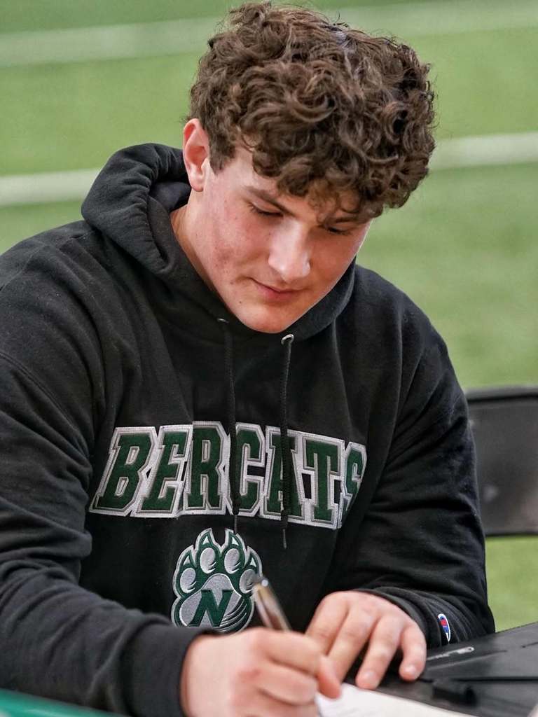 A Joe T. Robinson footbal player signing to play at Northwest Missouri State
