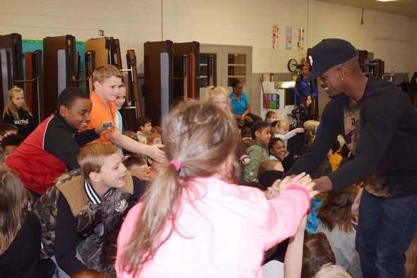 Olympian Jeff Henderson with PCSSD elementary students