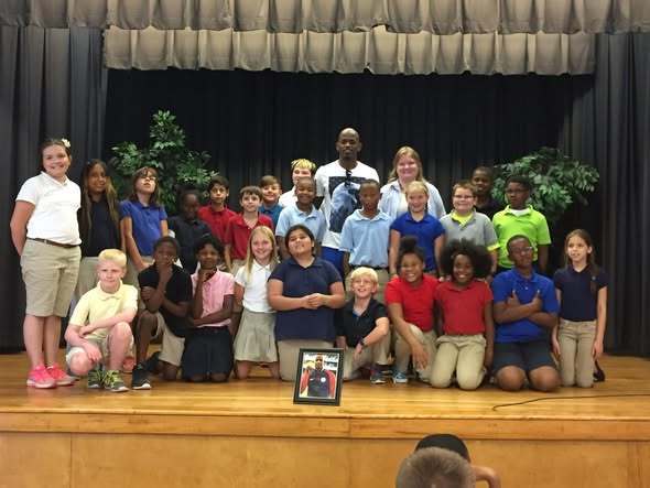 Olympian Jeff Henderson with PCSSD elementary students