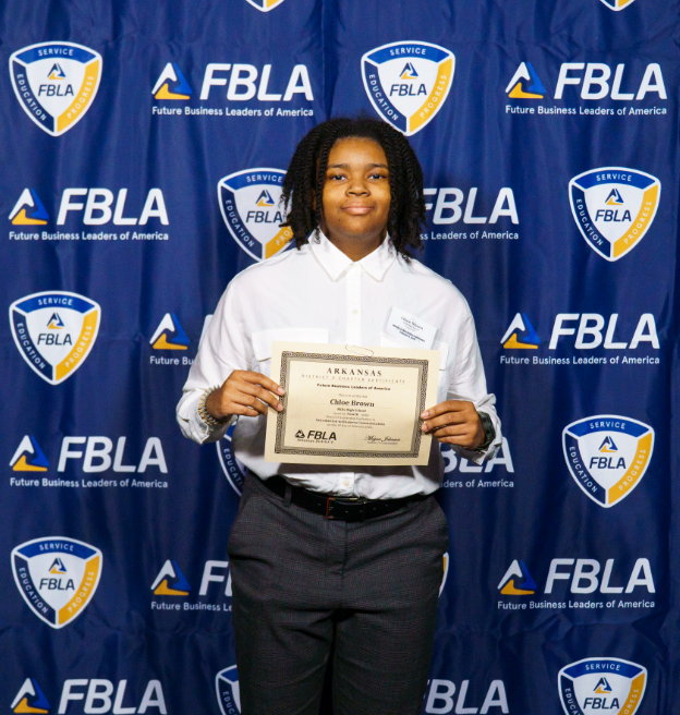 Student with an FBLA certificate