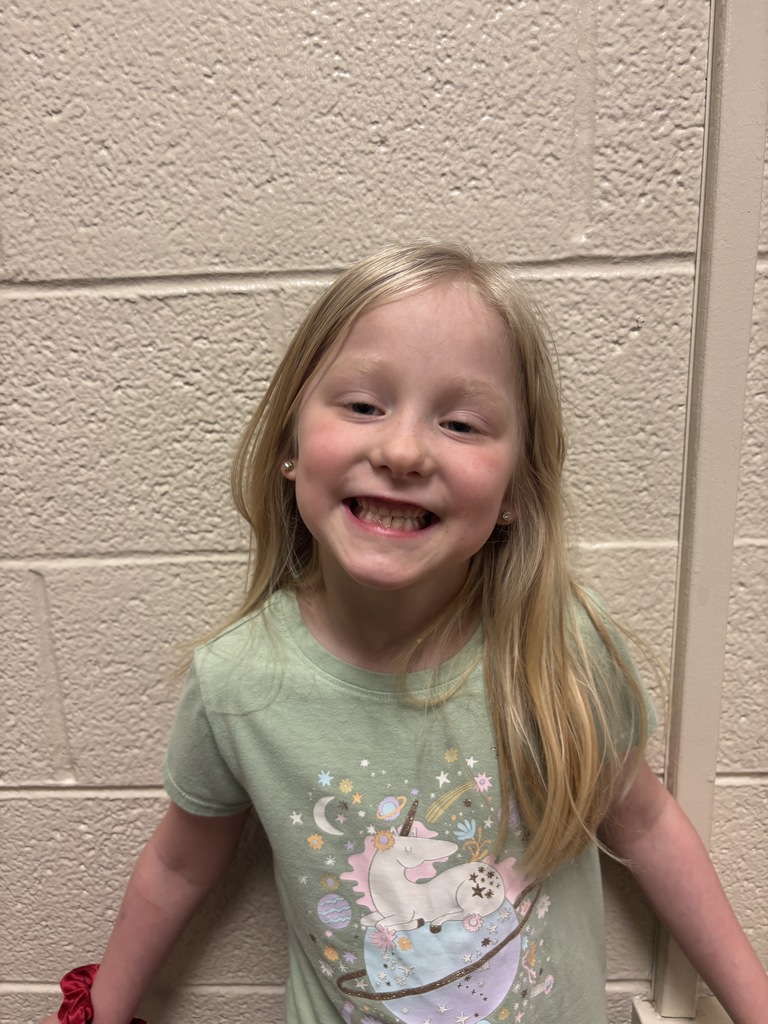 Kindergarten student who was nominated for Student of the Month. She is in a green t shirt. 