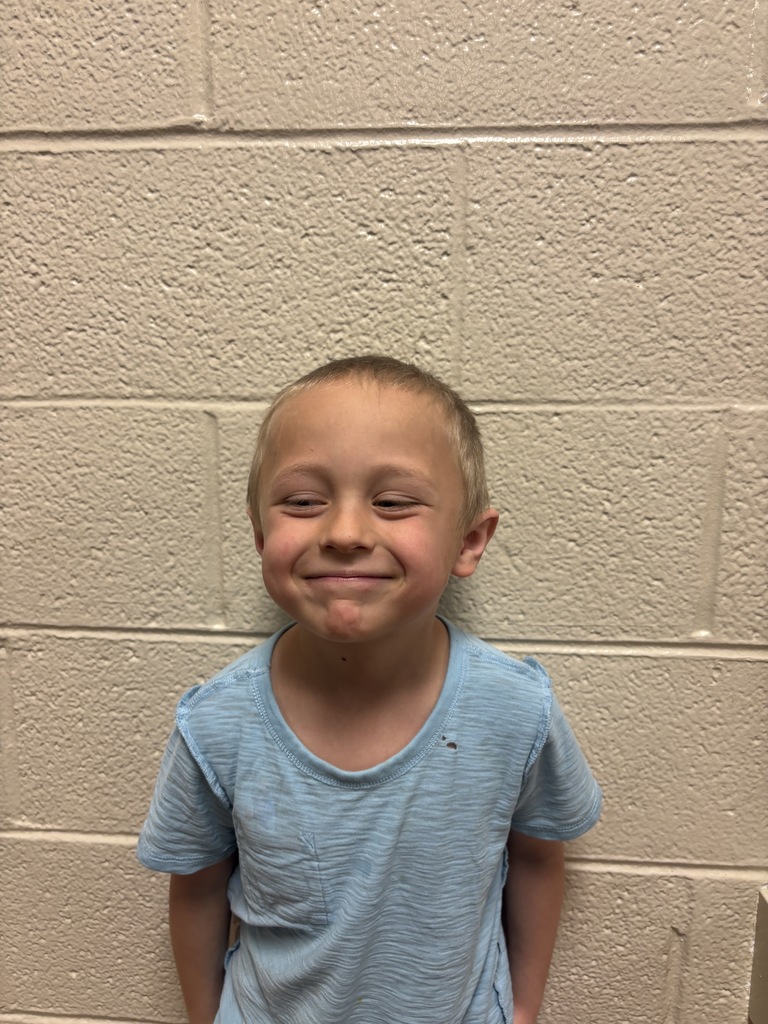 Kindergarten student who was nominated for Student of the Month. He is in a blue t shirt. 