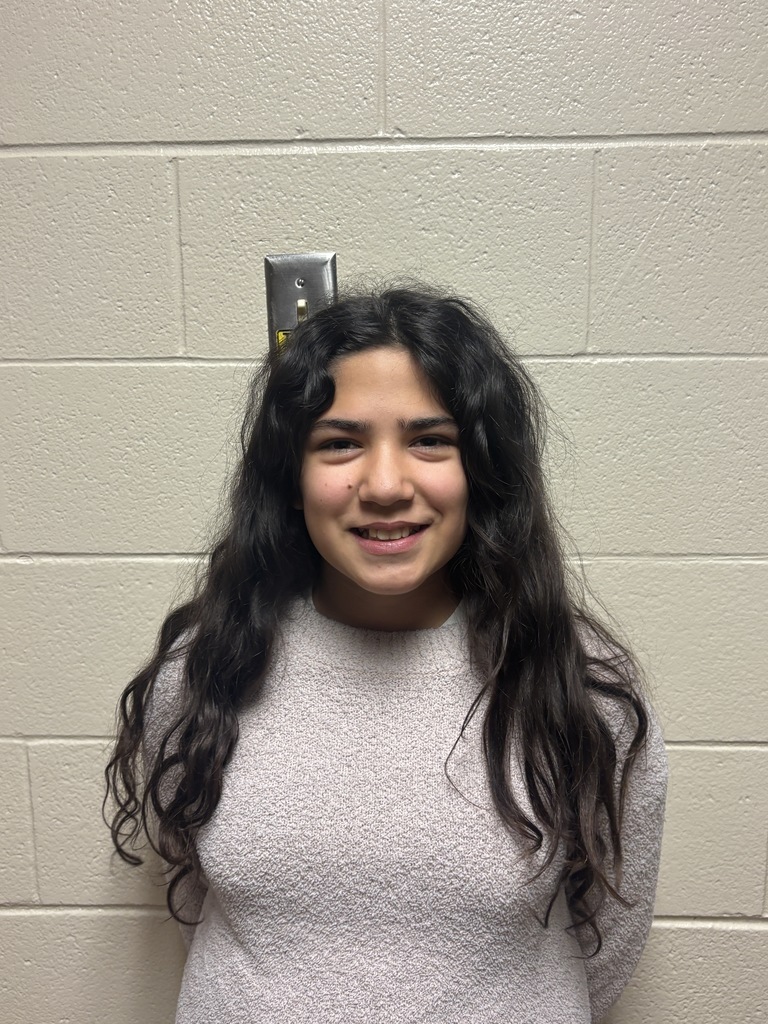 Fifth Grade student who was nominated for Student of the Month. She is in a beige sweater. 