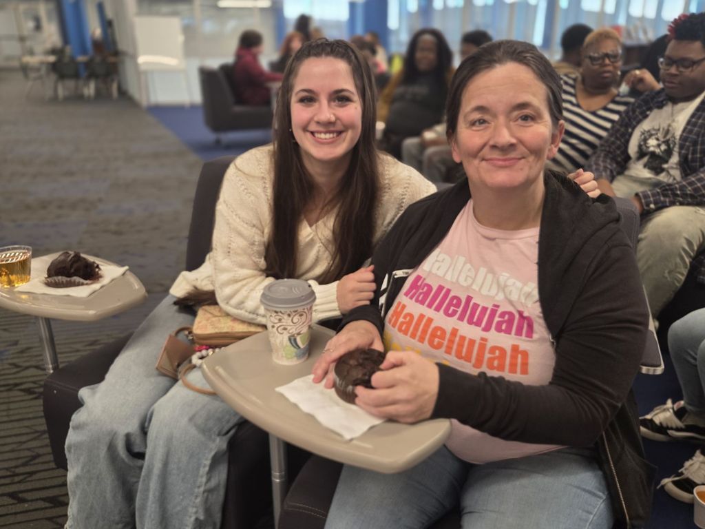 A picture of a mother and daughter smiling together
