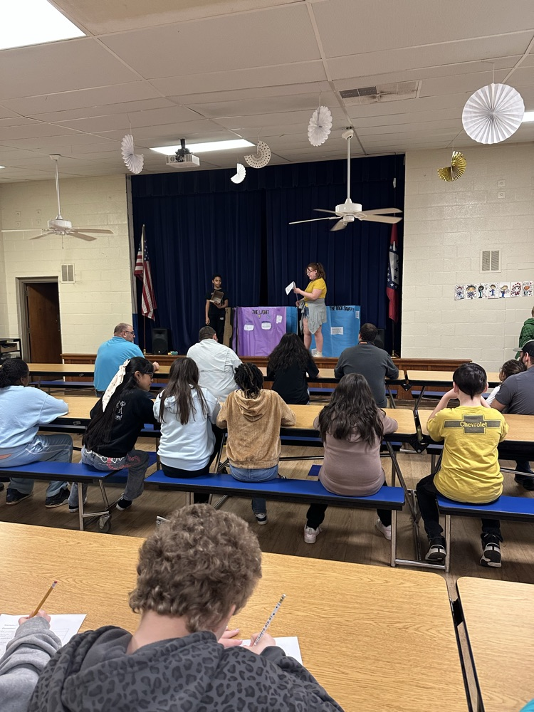 image of 5th grade student who is pitching her “The Light” invention. it is used to help you see into the mailbox  