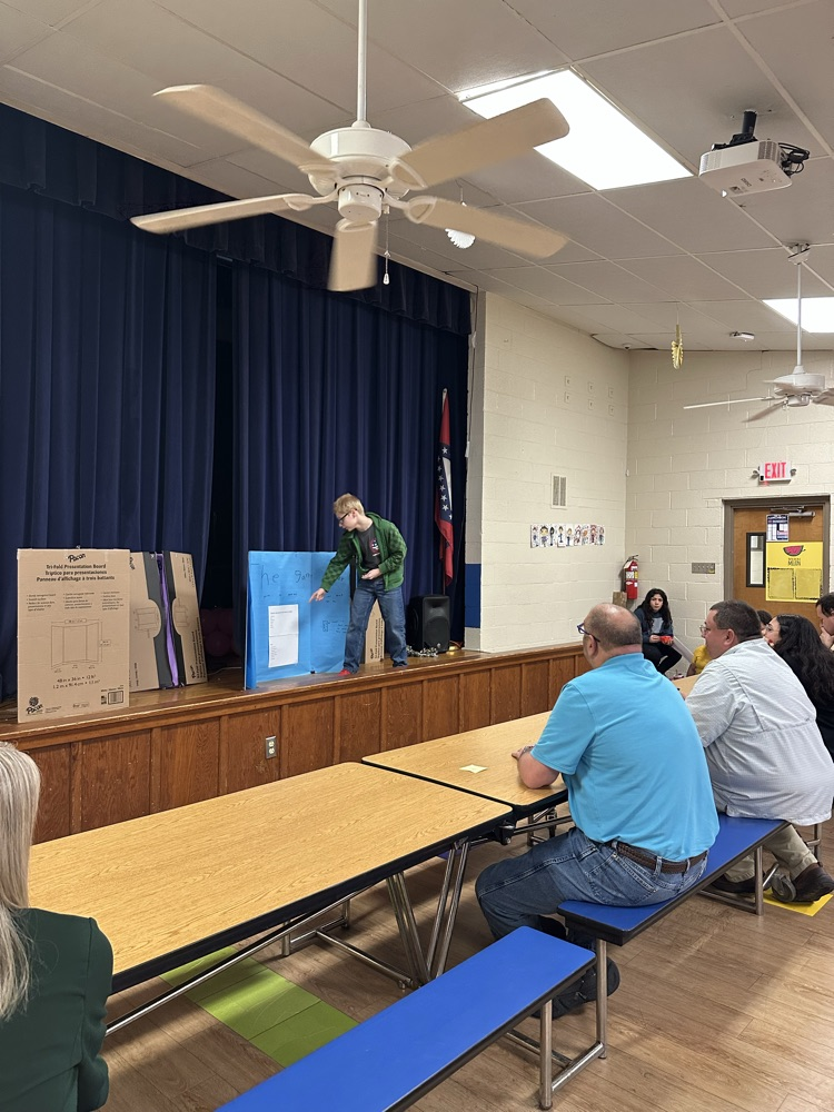 Image of a fifth grade student. His invention was the game cooler. It is used to cool a gaming system.