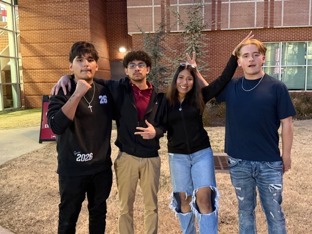 A group of 4 students standing together