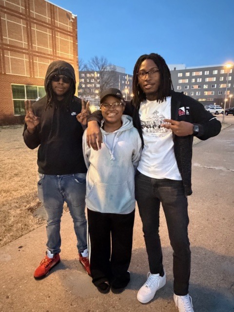 A group of 3 students standing together