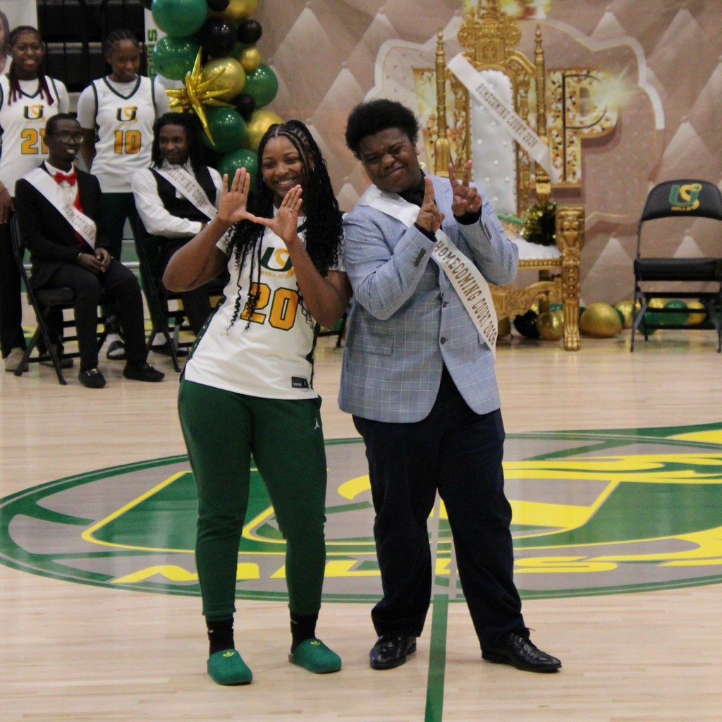 A boy and girl of the homecoming court posing together