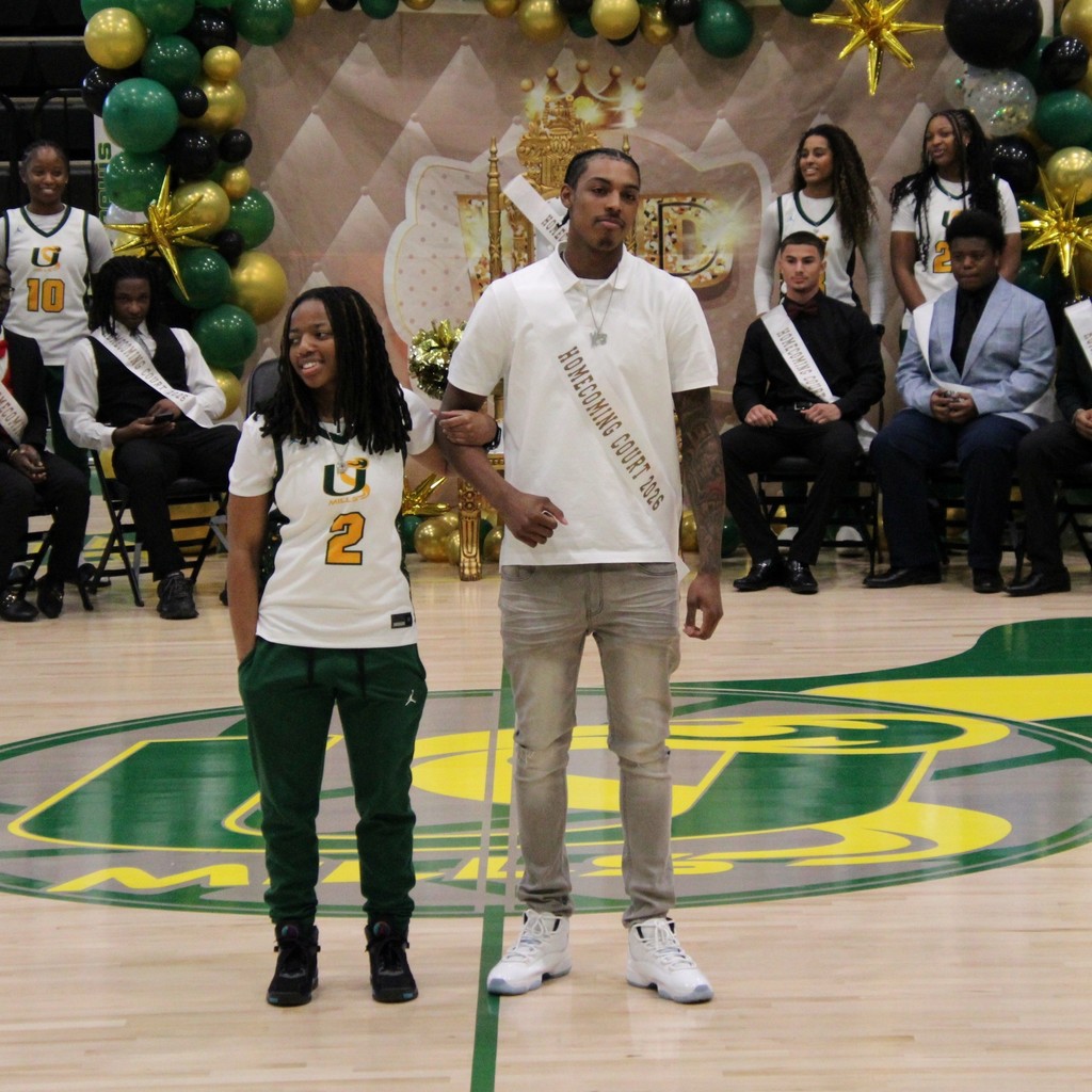 A boy and girl of the homecoming court posing together
