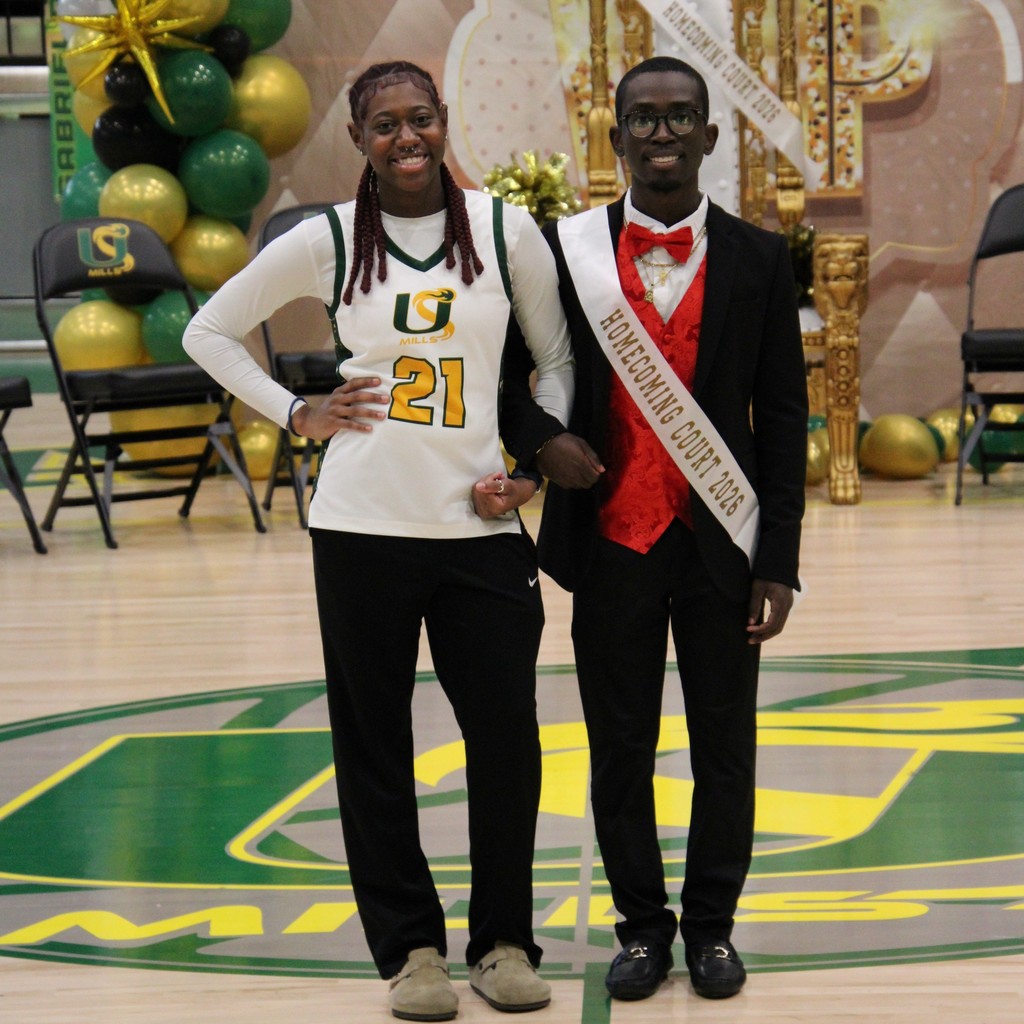 A boy and girl of the homecoming court posing together