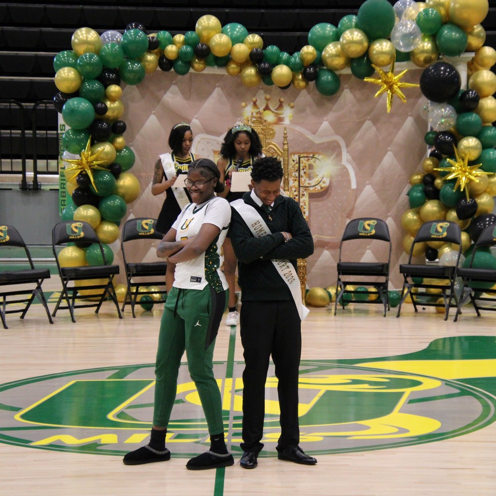 A boy and girl of the homecoming court posing together