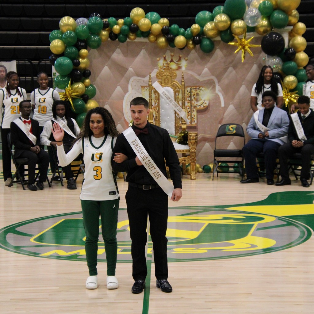 A boy and girl of the homecoming court posing together