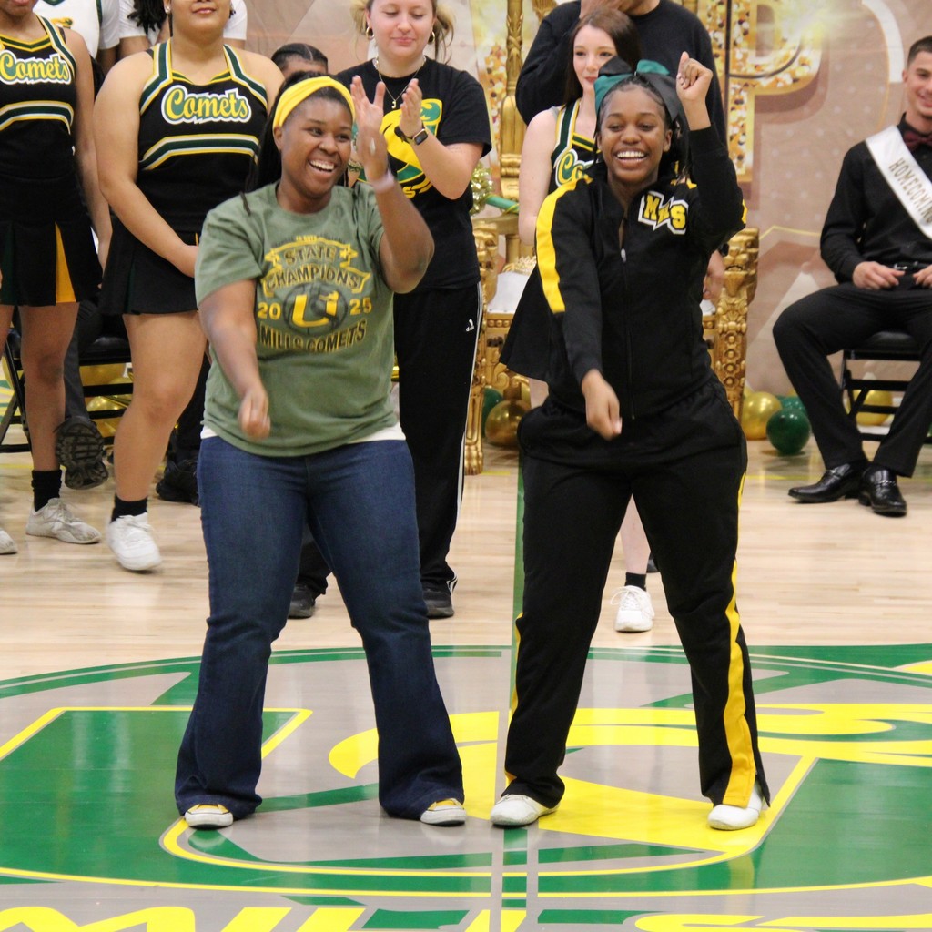 A boy and girl of the homecoming court posing together