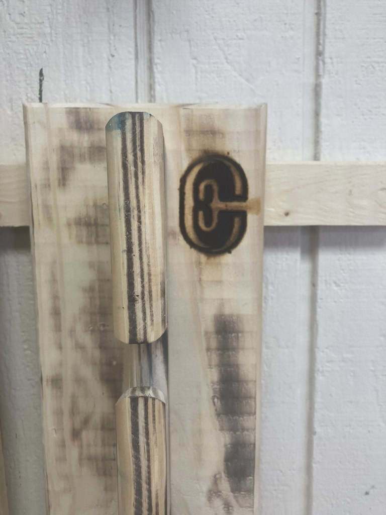 A close-up of an unpainted hat rack