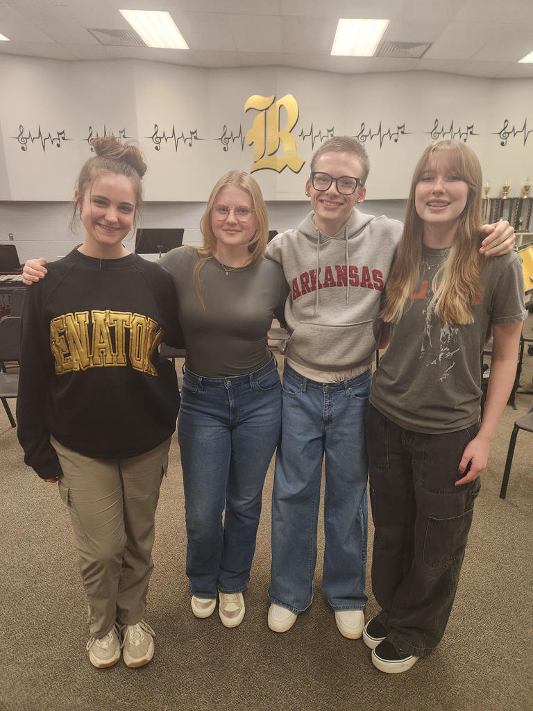 All-State Choir Members  are all smiles while posing for a group picture in the Robinson High School choir room. 