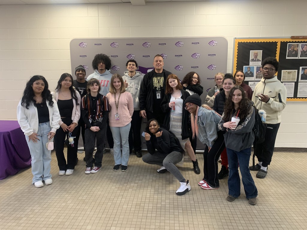 Students and their teacher pose for a group shot while at Ouachita Baptist University 