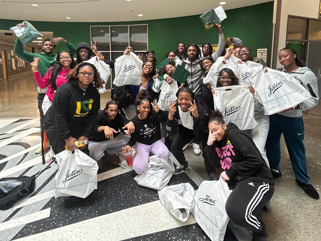 Seniors with cap and gown bags