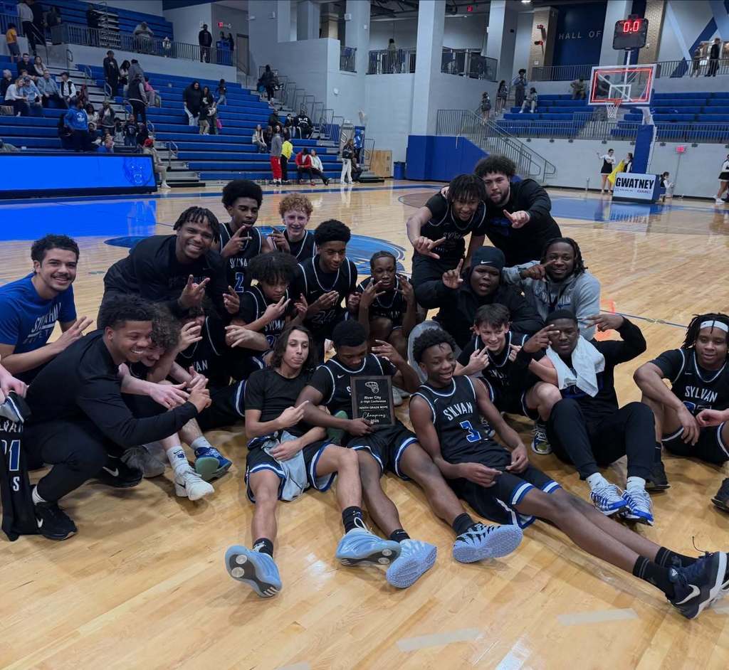 Sylvan Hills Jr. High Basketball team at on a basketball court