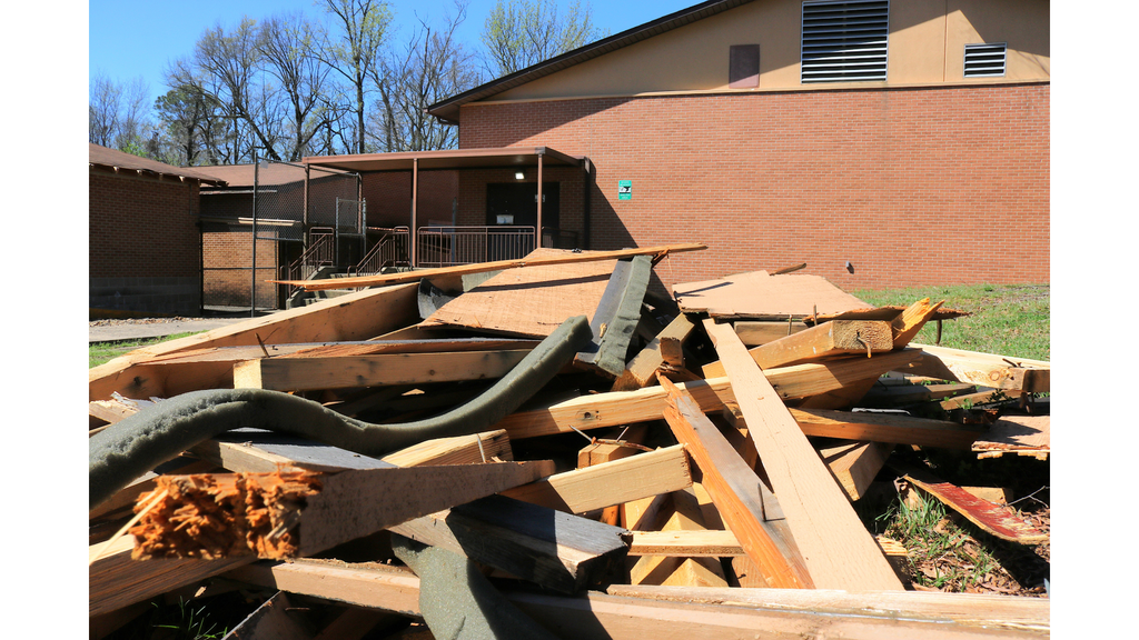 Construction debris leading up to entrance of storm shelter