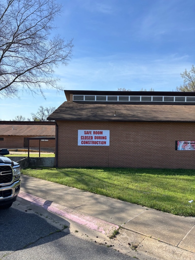 Side of the building that includes a sign to say "Closed"