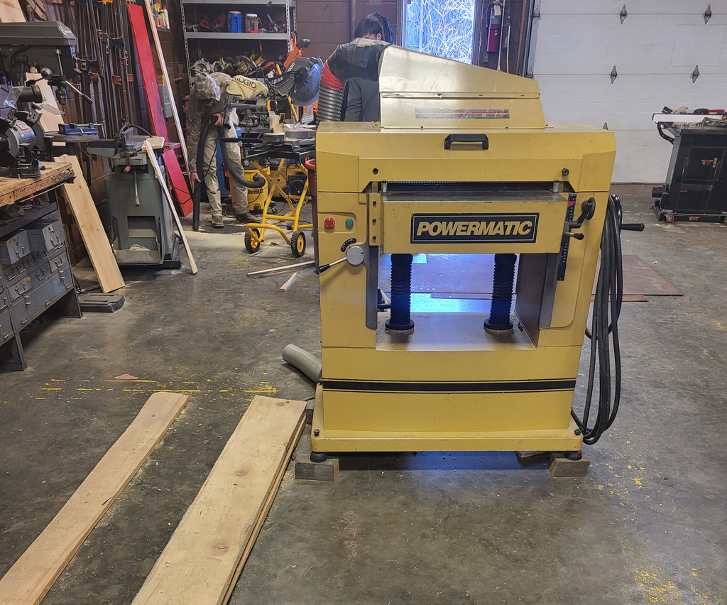 Students used a thickness planer to prepare lumber prior to construction. 