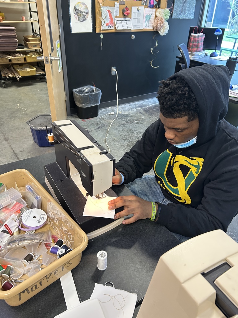 Student working at sewing machine