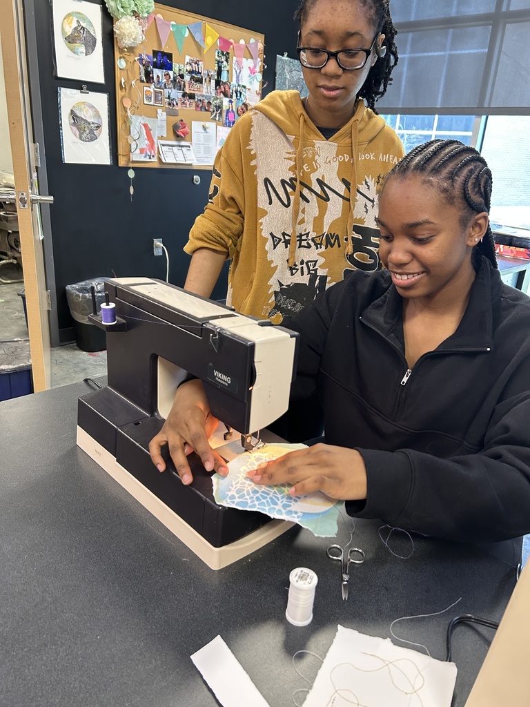 Students at sewing machine