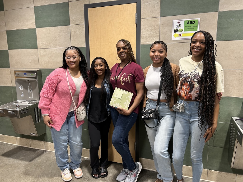 Group of female students with their lead custodian