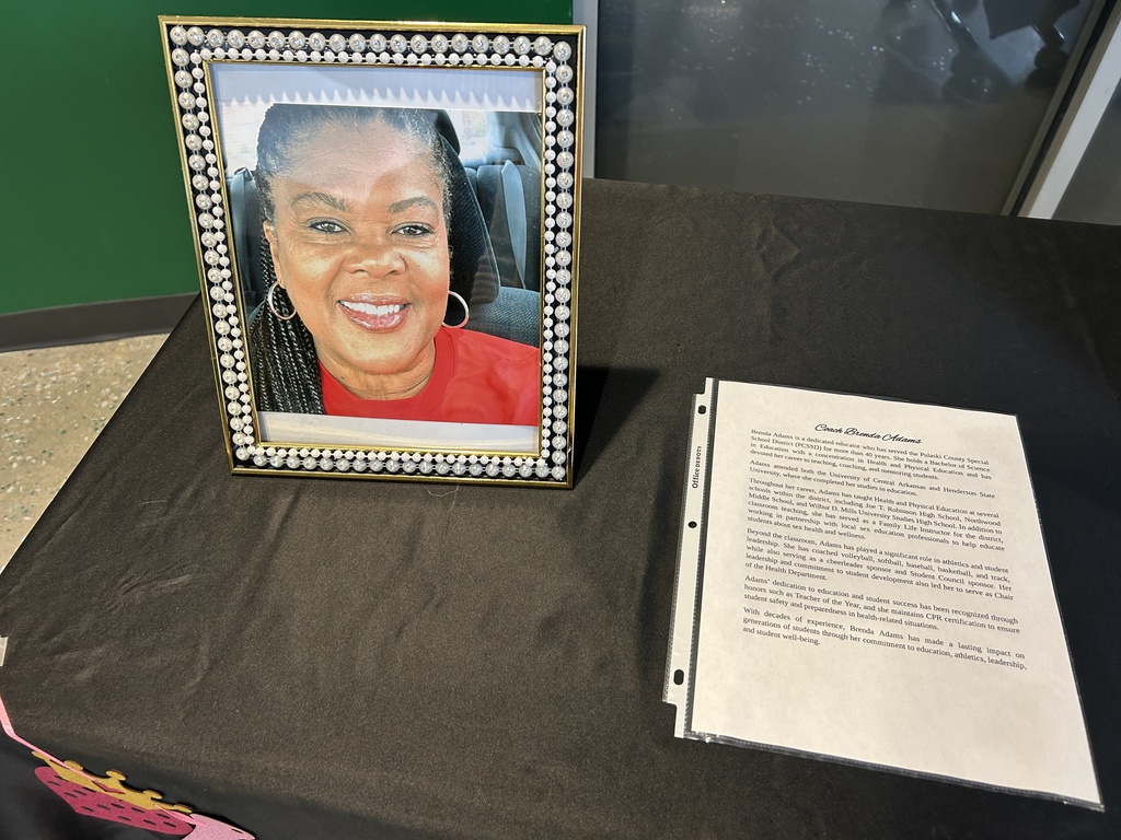 Photo in a frame beside paragraphs on paper