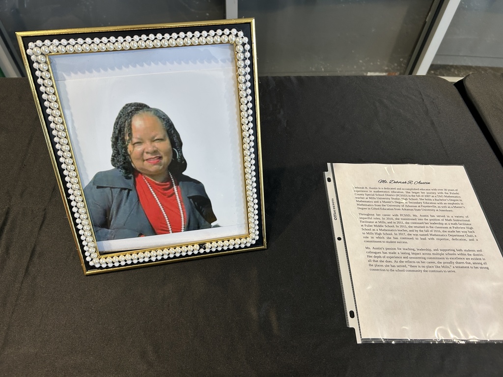 Photo in a frame beside paragraphs on paper