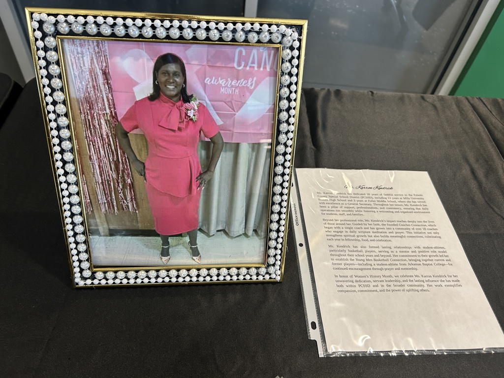 Photo in a frame beside paragraphs on paper