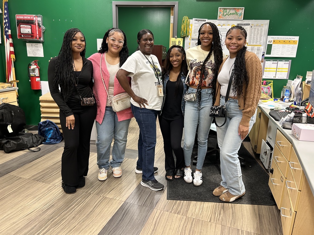 Group of female students with their office secretary