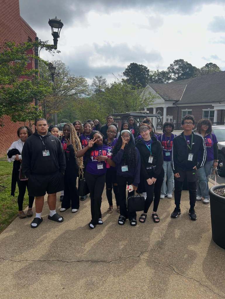 A group picture of Maumelle AVID Sophomores attending a college tour of Henderson State University. They are mostly wearing purple AVID shirts.