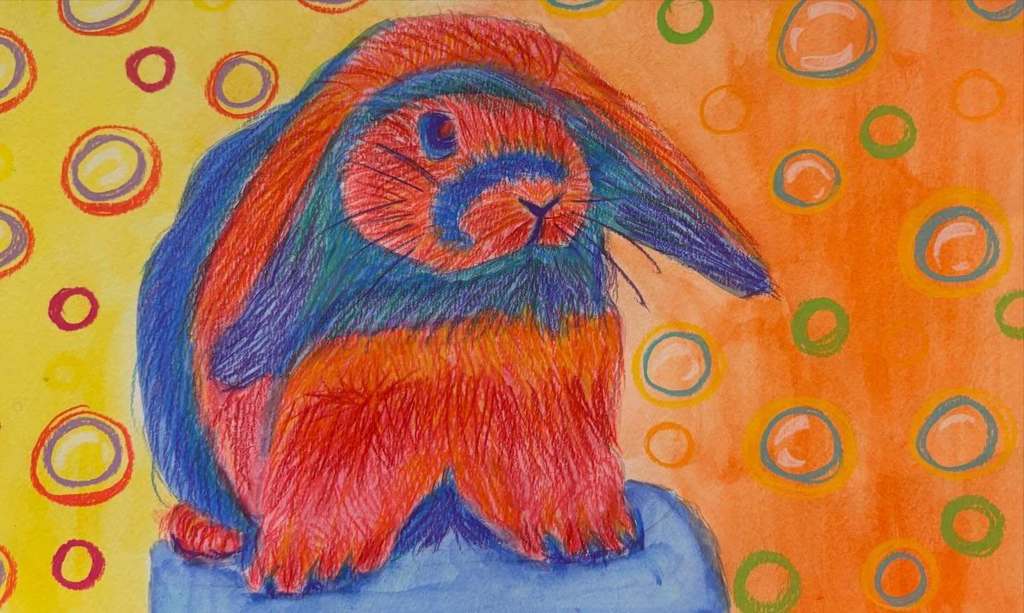 A fauvist‑style drawing of a rabbit in bold red, orange, blue, and green tones, sitting on a blue surface with a patterned yellow‑orange background.