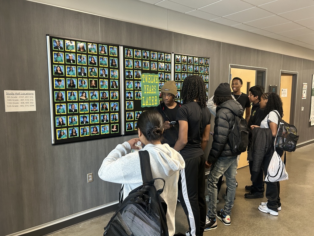 Students admiring senior photos