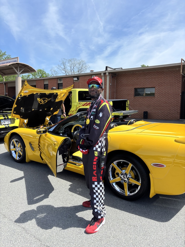 Coach Mac looks good in a Vette!