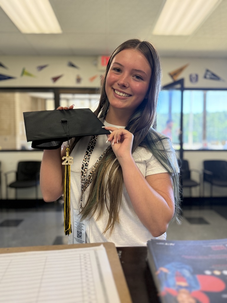 All smiles and shining bright! A RHS student loves the details on her tassel. 