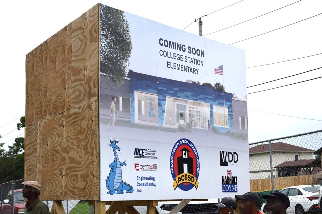 A sign of a picture that says "COMING SOON COLLEGE STATION ELEMENTARY"