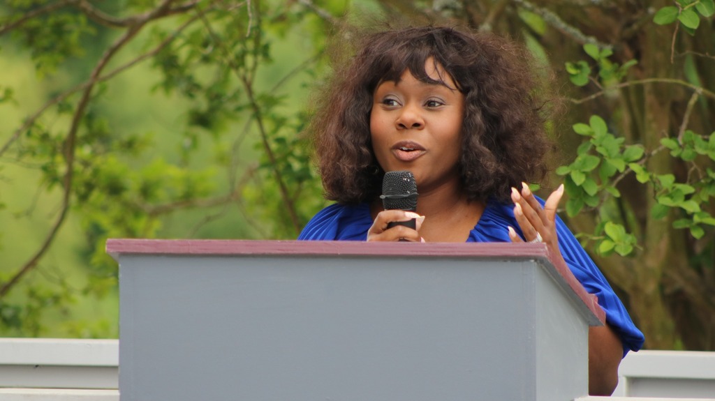 A woman speaking at a podium