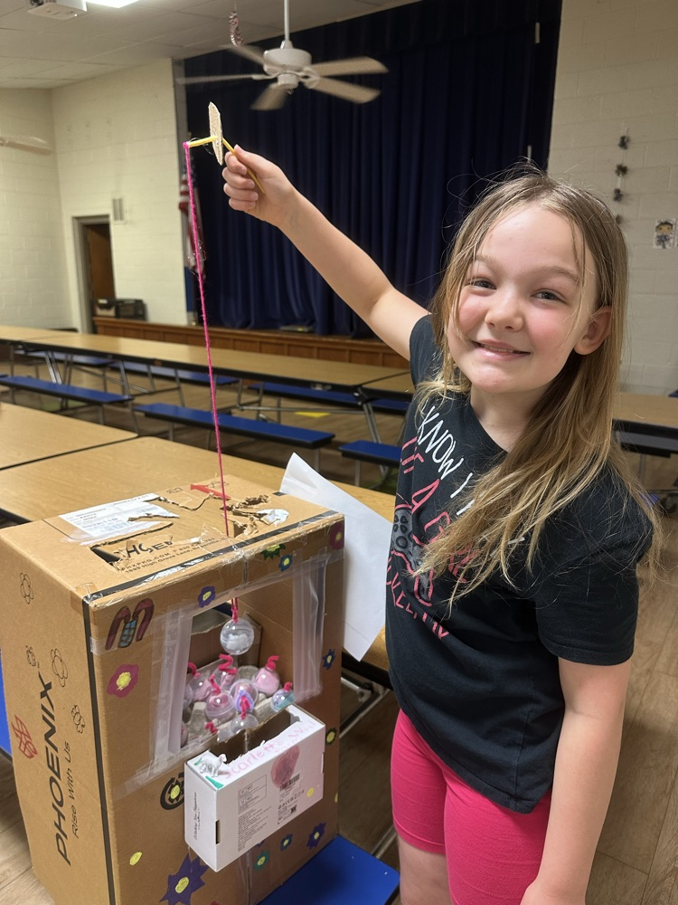 4th grade student with her claw machine