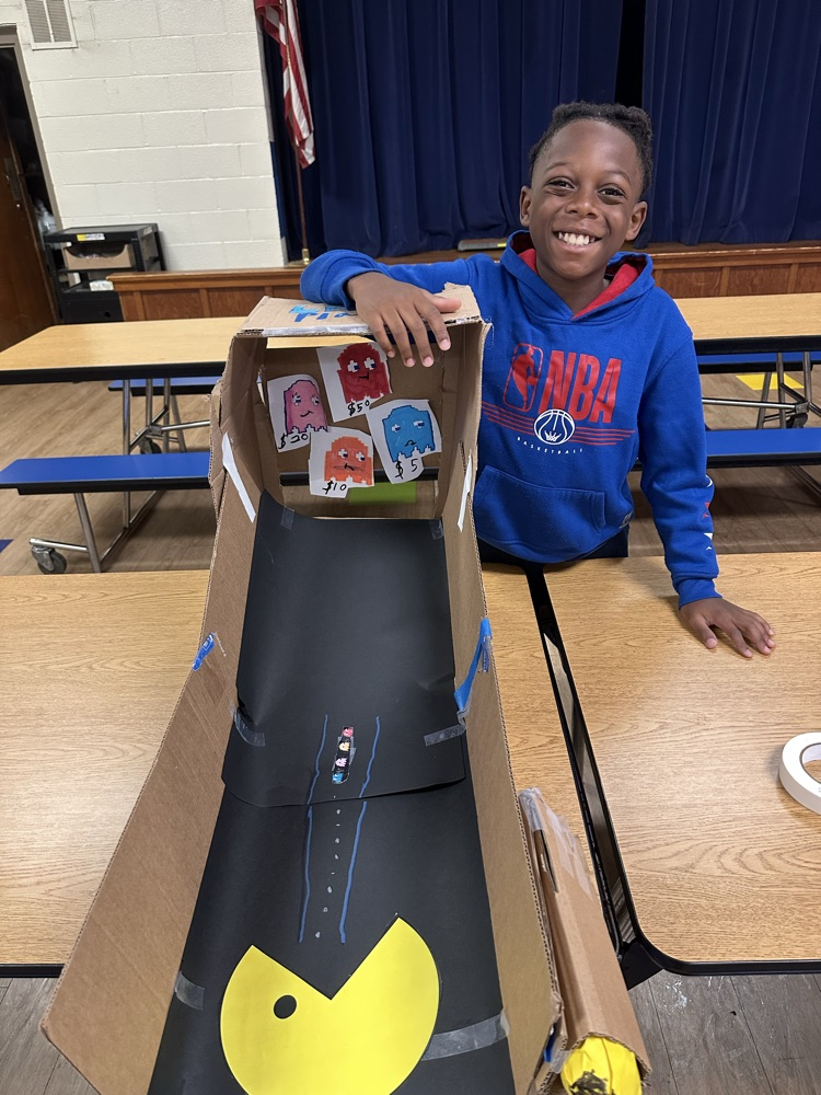 4th grade student with his Pac-Man game