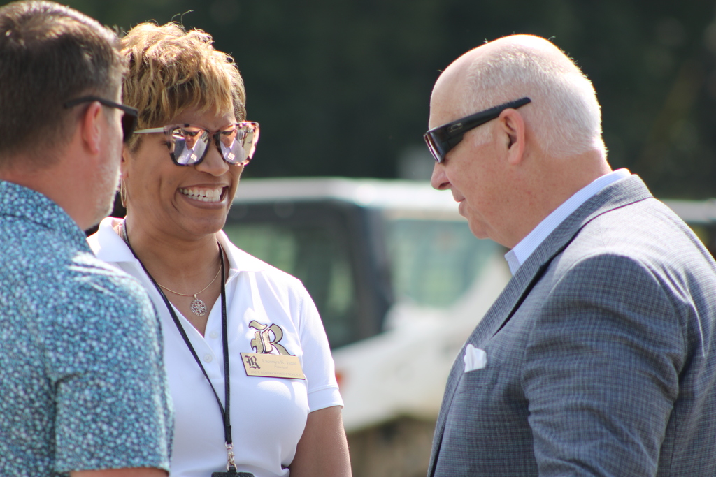 Joe T. Robinson High School Principal Laconya Isaac speaks with attendees during the topping out ceremony for the new school addition.