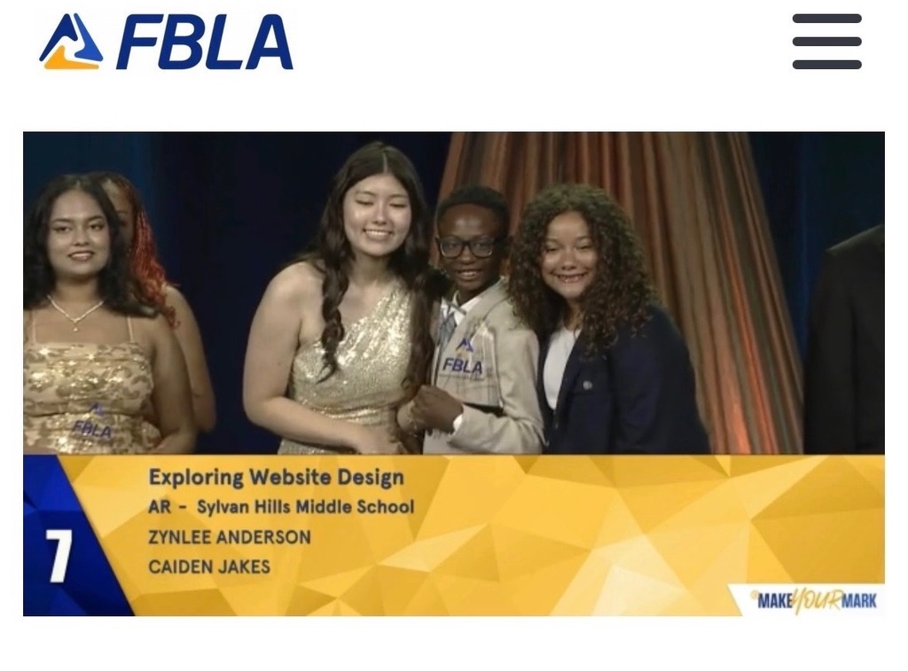 A picture of two students receiving their trophy for seventh place in Exploring Web Design